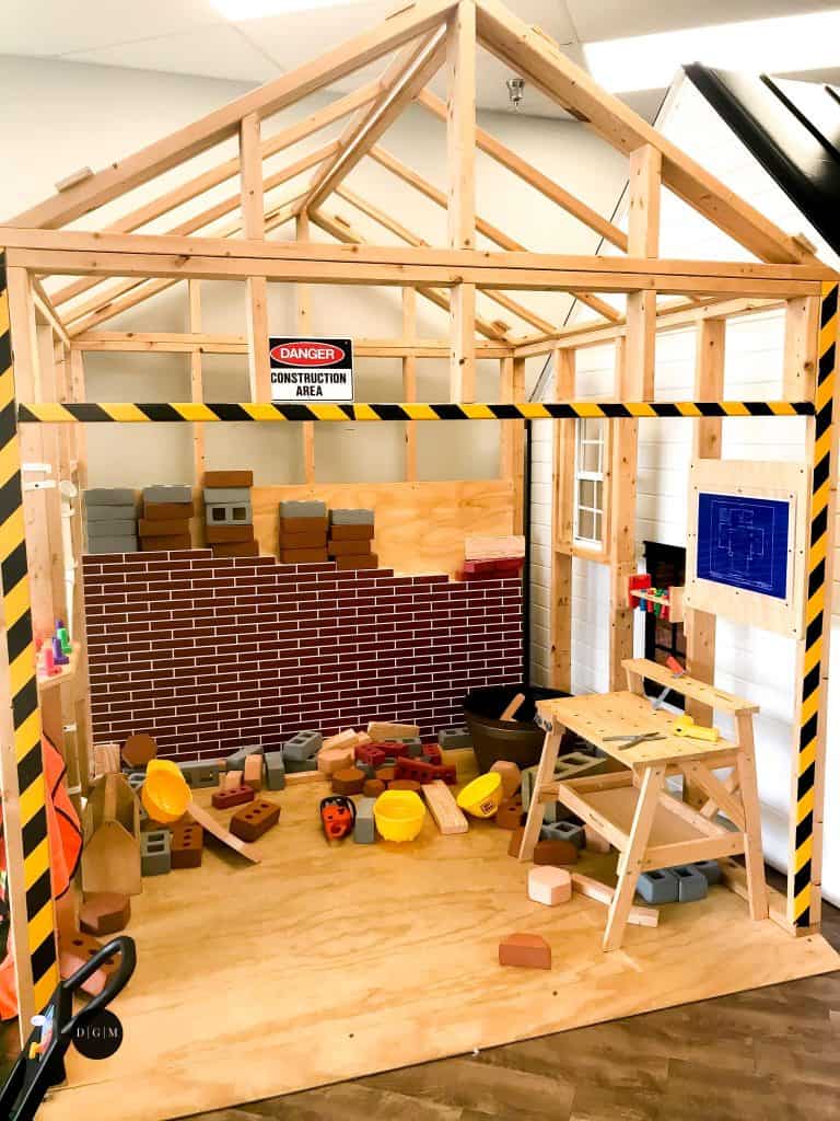 Construction pretend play at indoor play center
